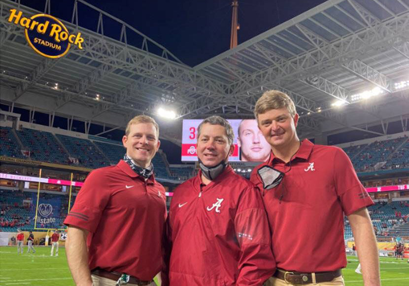 Andrews doctors frequently act as team physicians to nearby sports teams. Here Drs. Zachary Pharr, E. Lyle Cain Jr., and Norman Waldrop at the National Championship
game last January.
