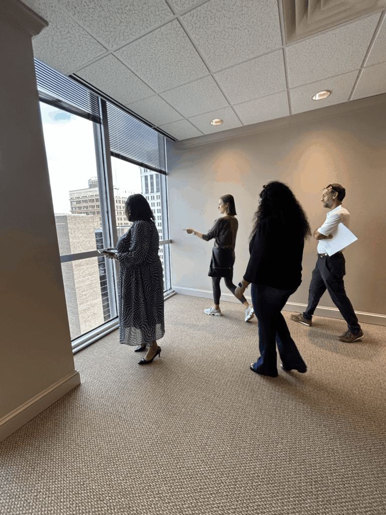 Meredith Calhoun, Tessa CRE, showing commercial office space