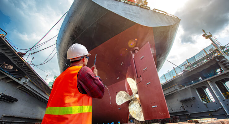 AAA USA, large ship with worker below on the dock. 