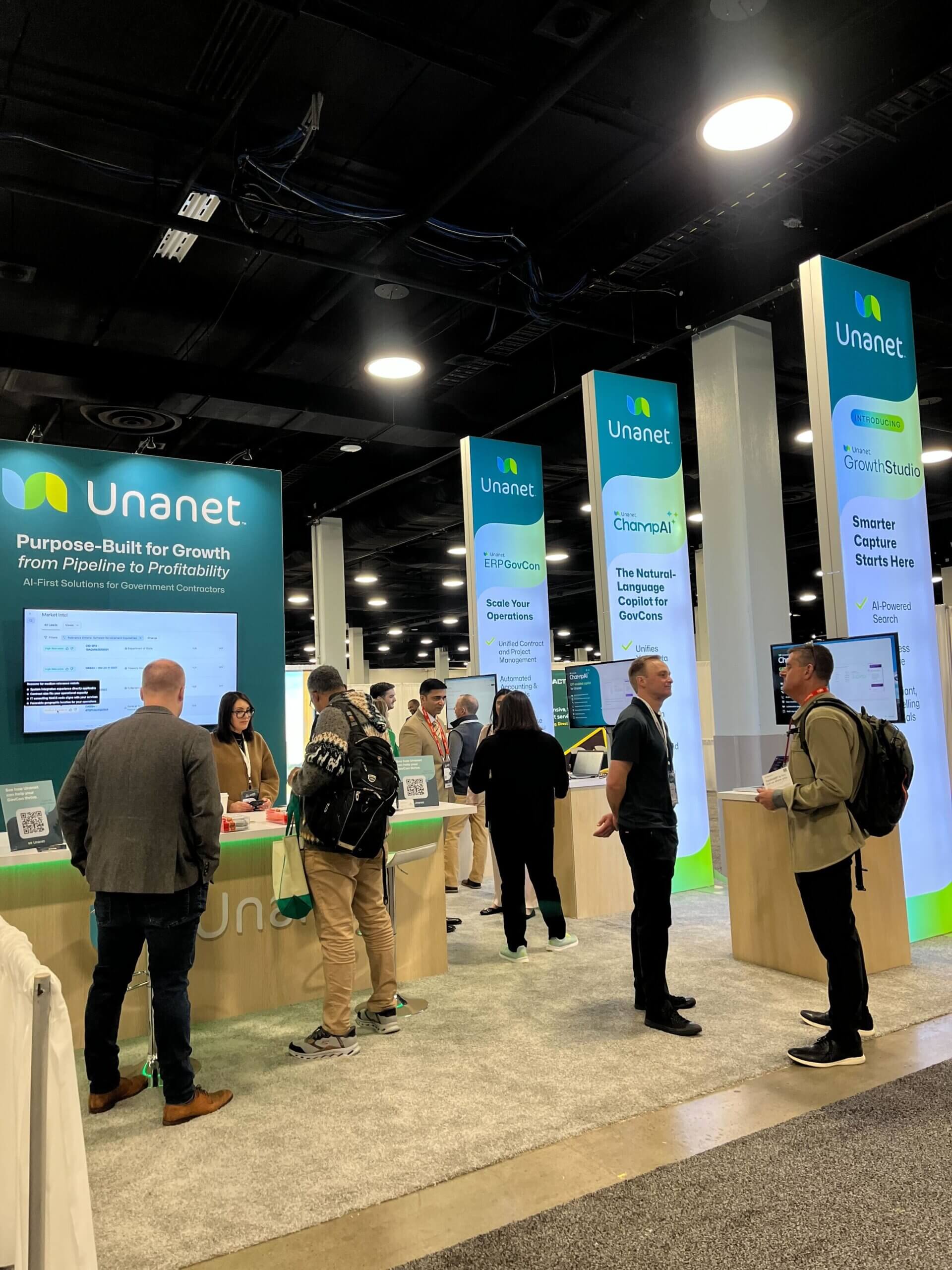 Unanet representatives meeting with government contracting professionals